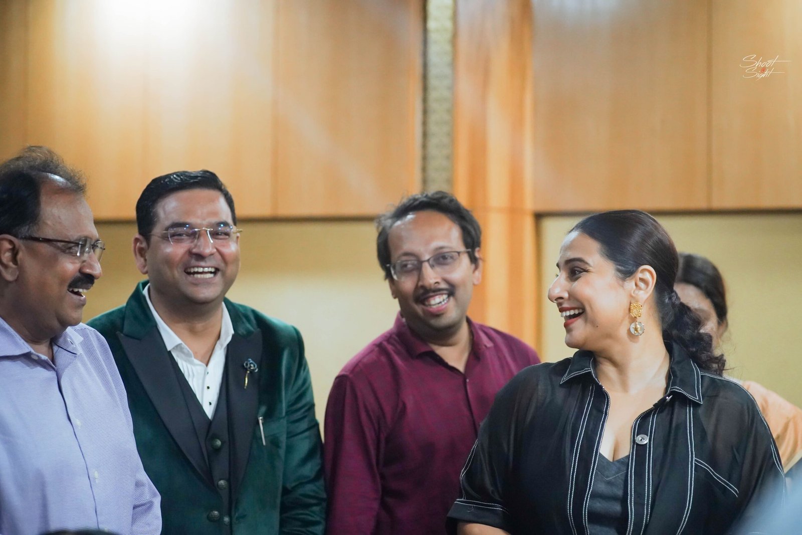 Team discussion photographed during corporate conference