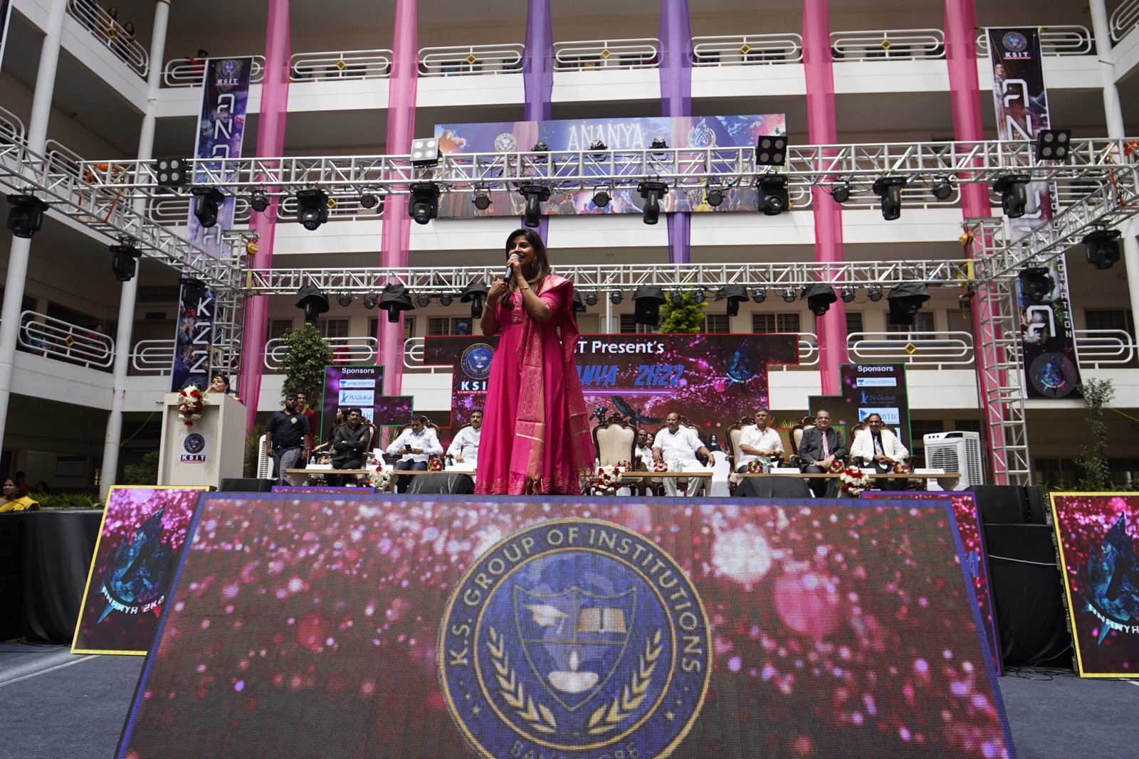 vibrant stage filled with dignitaries at college fest in bengaluru